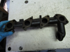 Picture of Kubota 1J811-12312 Exhaust Manifold to certain V2403-CR engine 1J811-12313 Cat Caterpillar 490-5930 C2.4